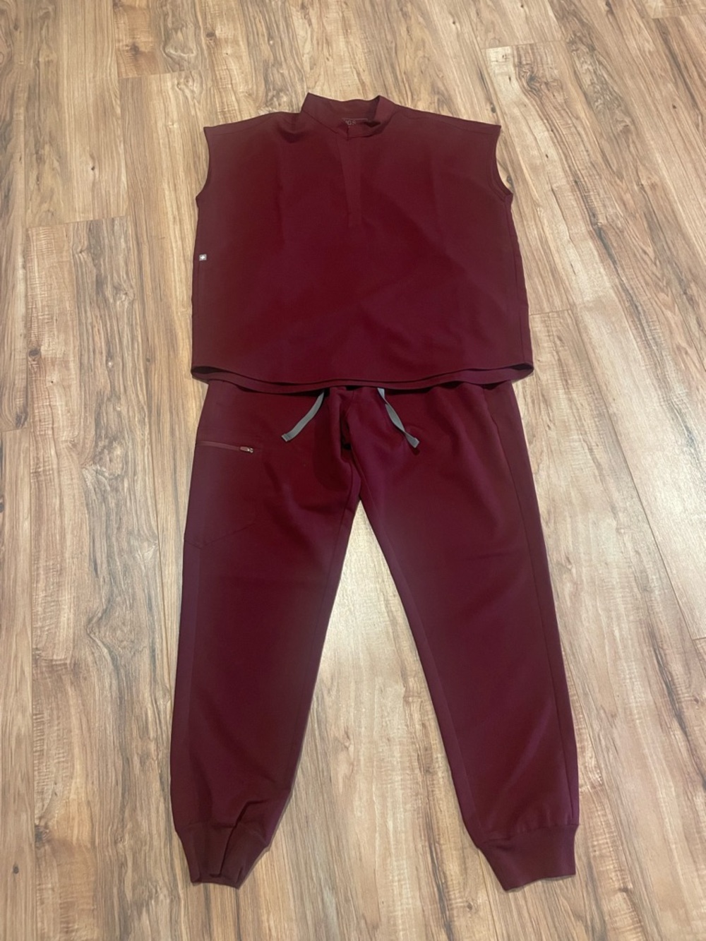 Figs Women’s Burgundy Zamora Jogger Pants and Rafaela Oversized Scrub Top.